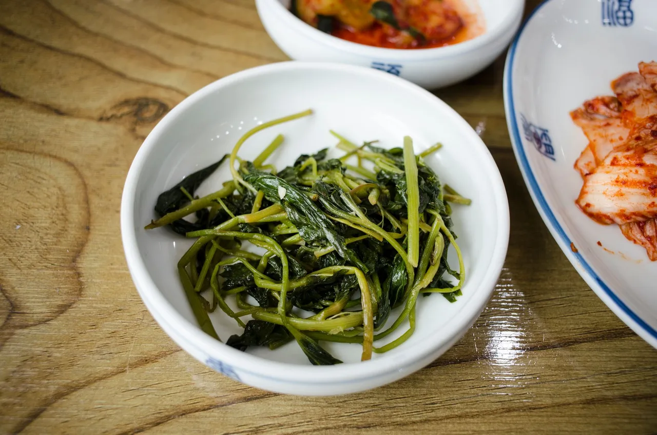 Assorted Korean seasoned vegetable side dishes in small bowls