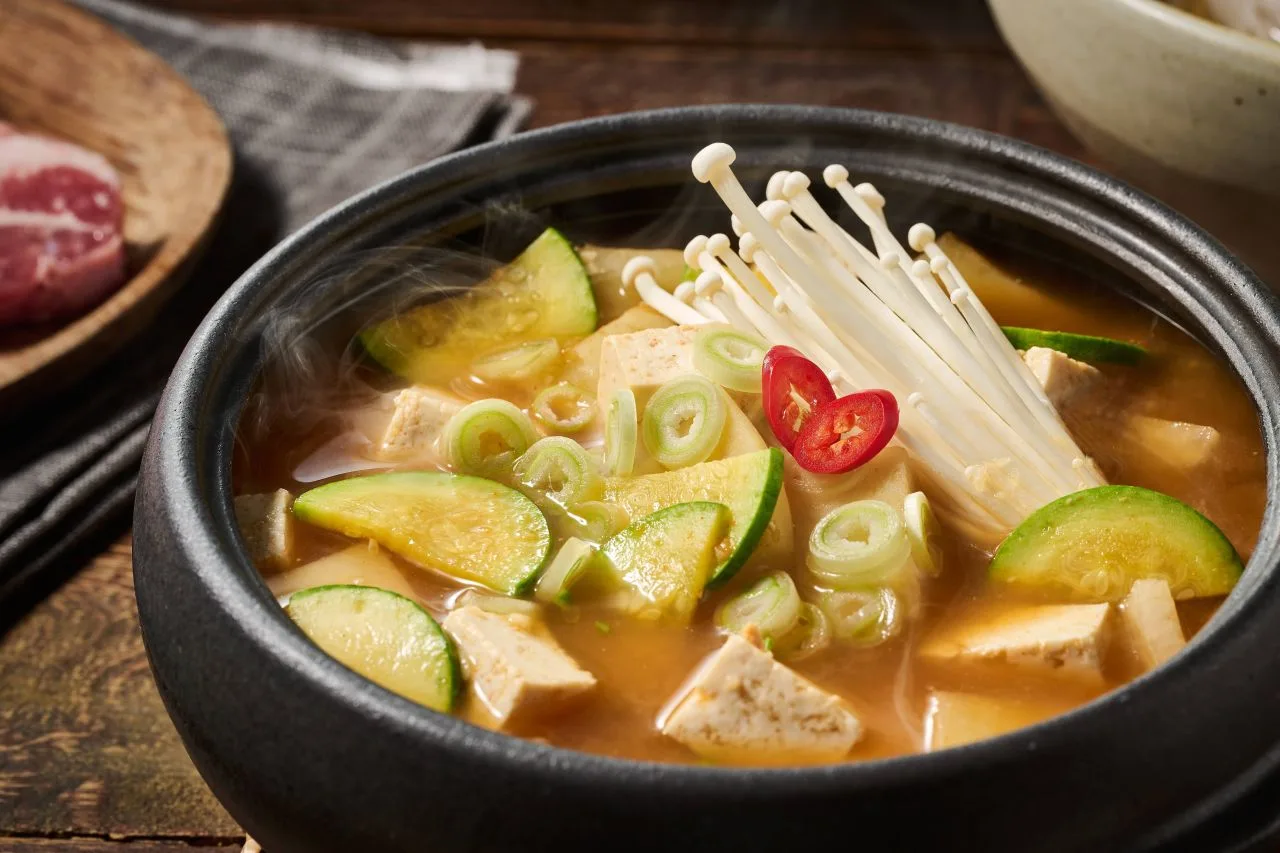 Preparing ground beef doenjang jjigae