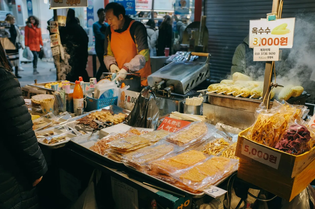 Food stalls and diners packed inside Gwangjang Market