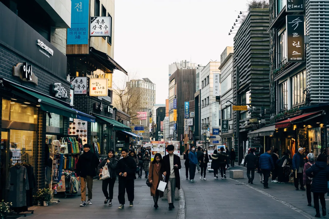 Shoppers along a busy Myeongdong street in Seoul